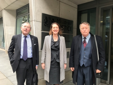 of Victoria Prentis MP outside the Ministry of justice with James Macnamara (left) and George Green (right)